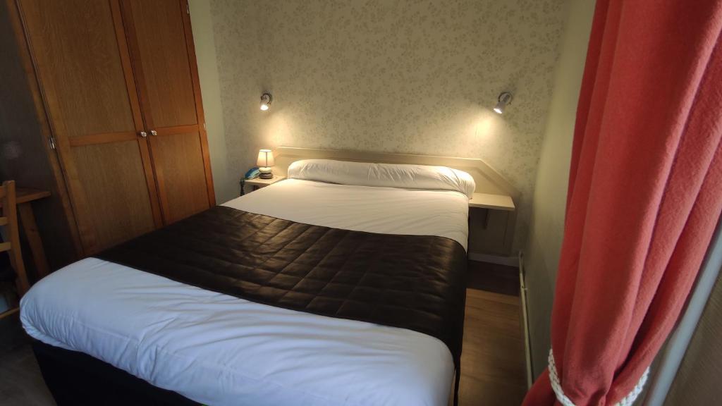 Postel nebo postele na pokoji v ubytování Hotel Angleterre