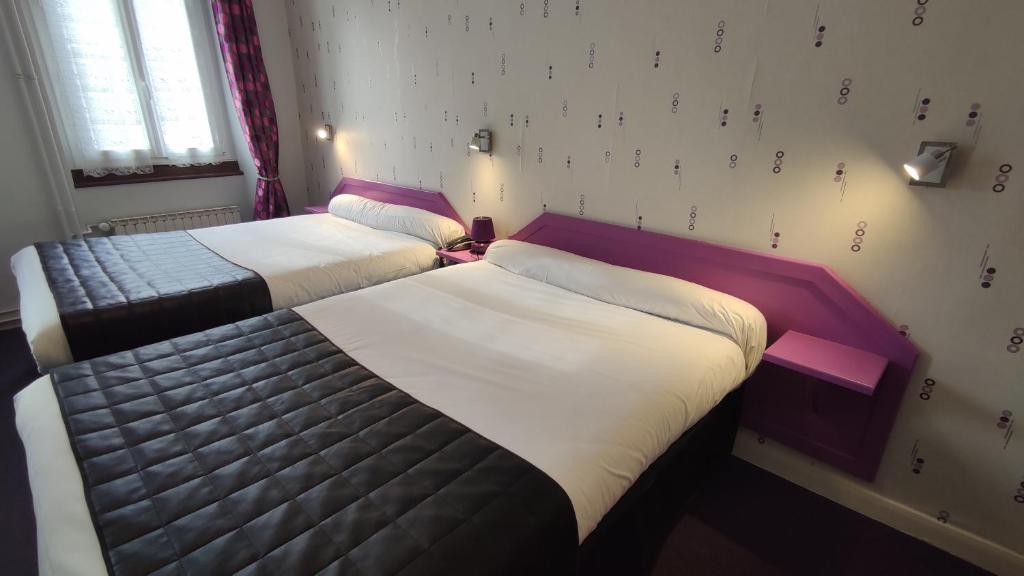 Postel nebo postele na pokoji v ubytování Hotel Angleterre