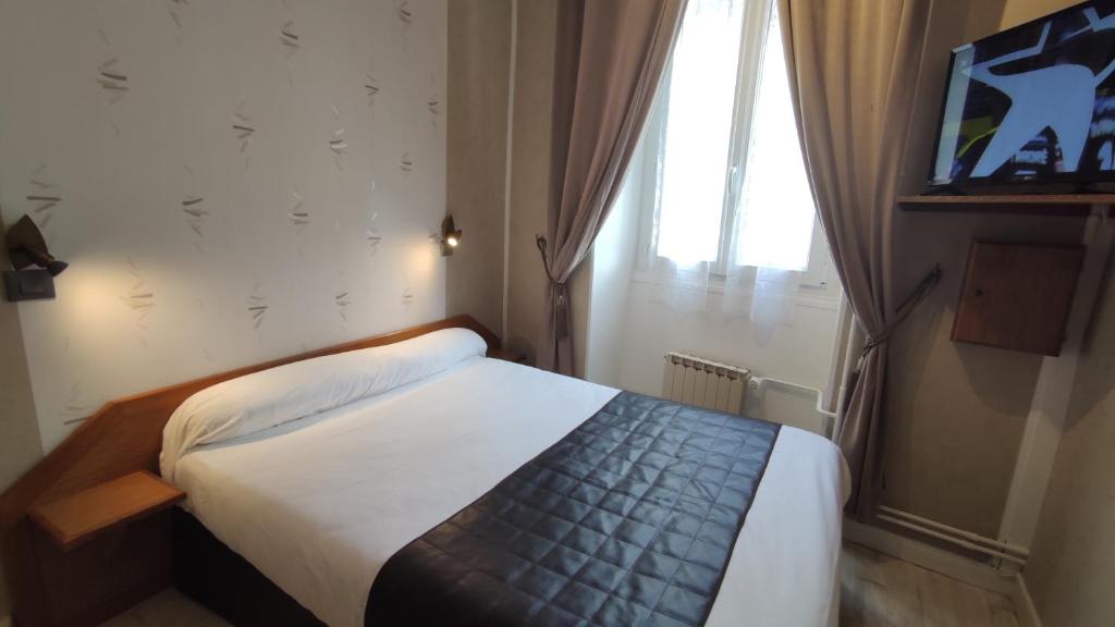 Postel nebo postele na pokoji v ubytování Hotel Angleterre