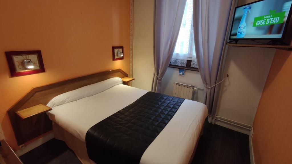 Postel nebo postele na pokoji v ubytování Hotel Angleterre