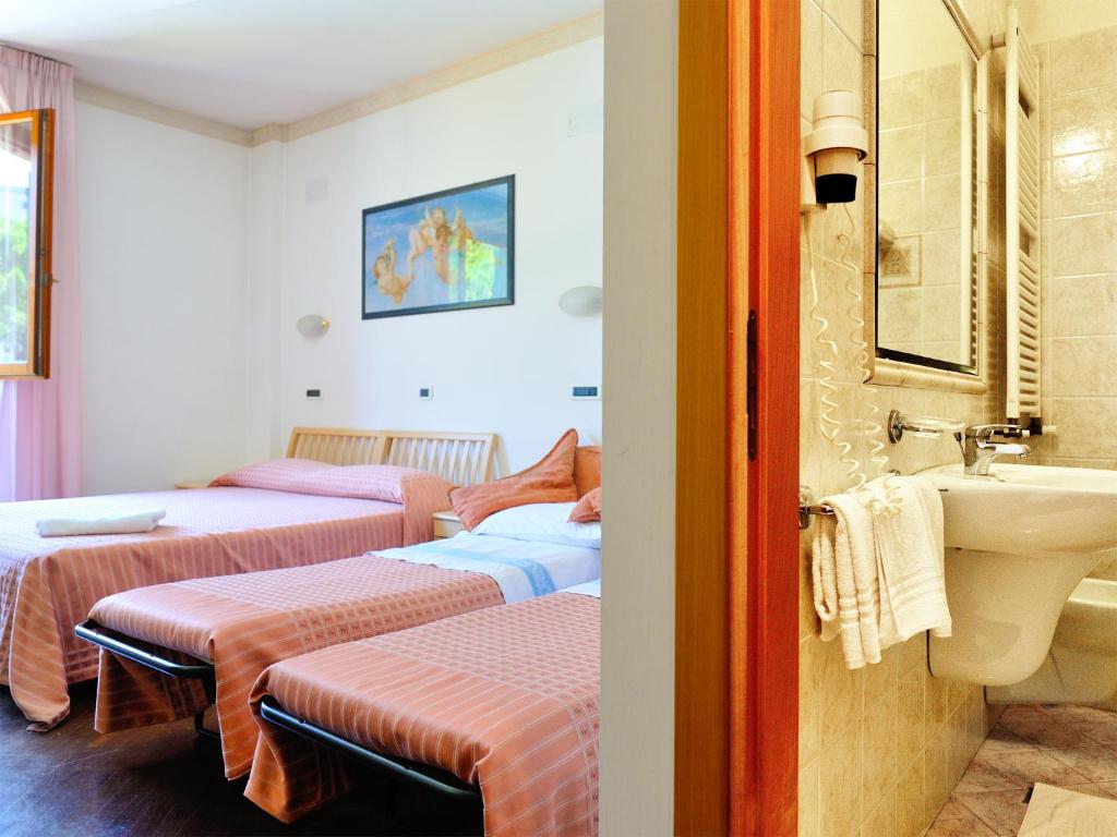 Postel nebo postele na pokoji v ubytování Albergo Bice