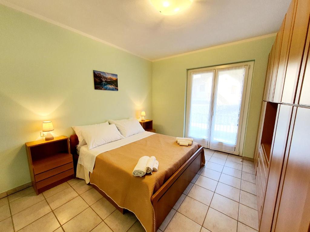 Posteľ alebo postele v izbe v ubytovaní Beach Apartment Cannobio