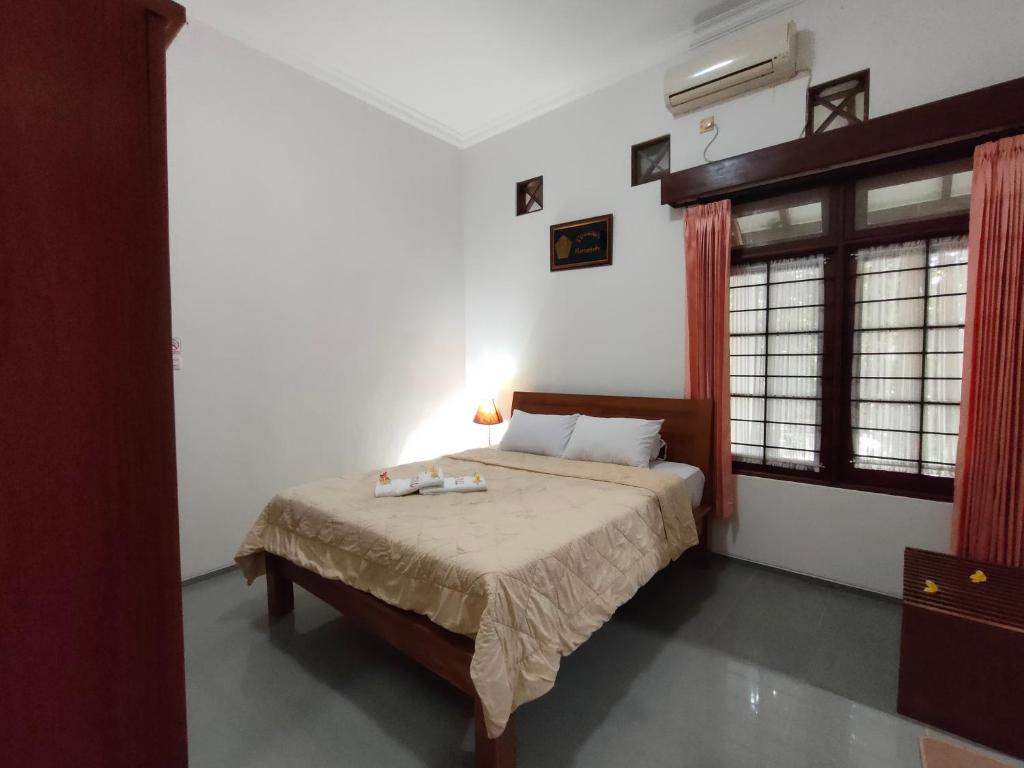 Postel nebo postele na pokoji v ubytování Ayodya Inn , Yogyakarta Lodging , Digital Nomads , Entrepreneurs Centre , CoWorking Space , CoLiving , Kost Lengkap , Exclusive Boarding House and Student Accommodation in Jogjakarta City Center !