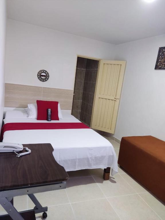 Postel nebo postele na pokoji v ubytování Hotel Mirador Plaza