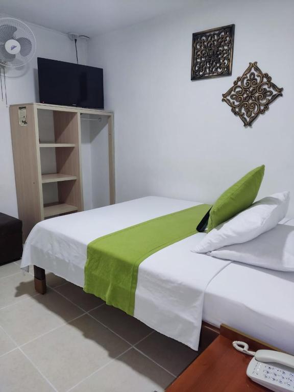 Postel nebo postele na pokoji v ubytování Hotel Mirador Plaza