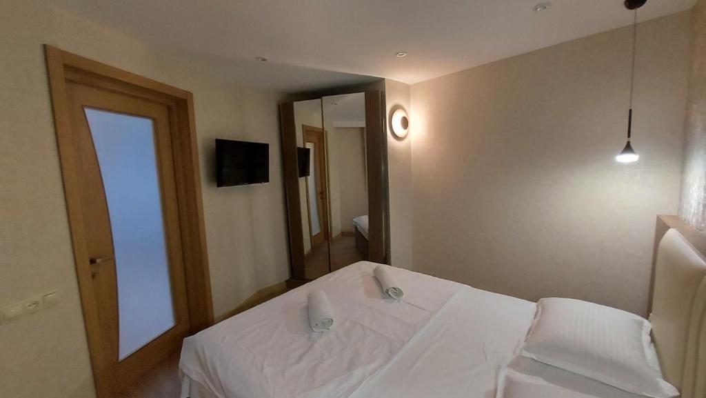 Postel nebo postele na pokoji v ubytování Hotel Visitor