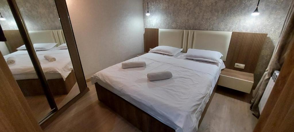 Postel nebo postele na pokoji v ubytování Hotel Visitor