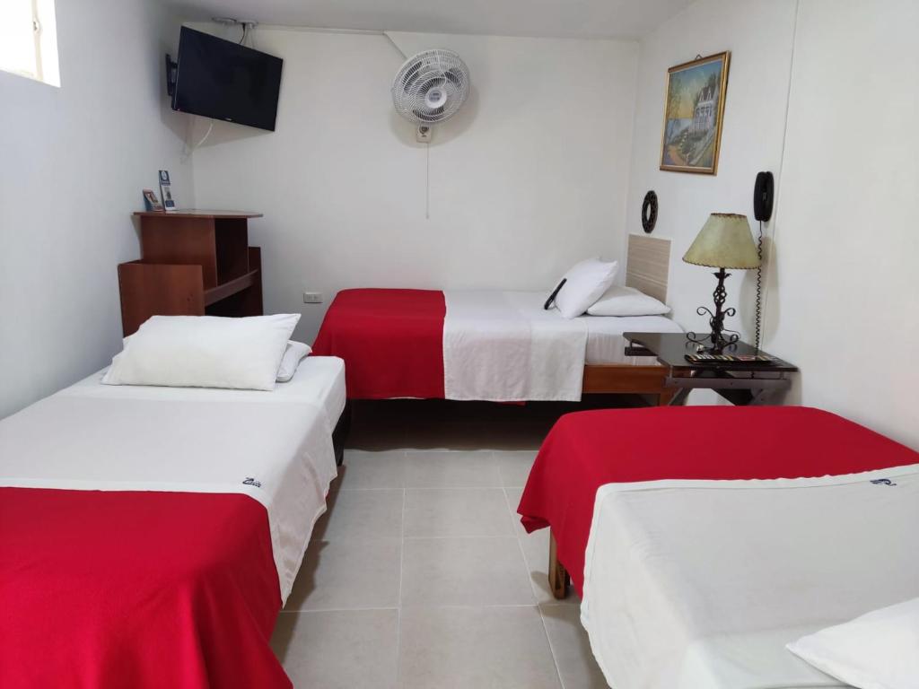 Postel nebo postele na pokoji v ubytování Hotel Mirador Plaza
