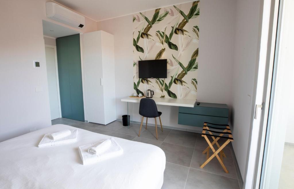 Postel nebo postele na pokoji v ubytování B&B Fior di Magnolia