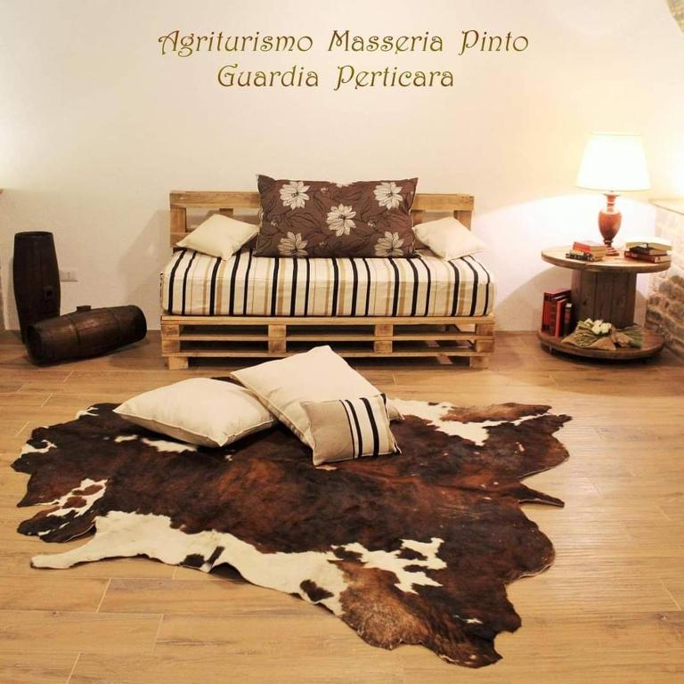 A bed or beds in a room at Agriturismo Masseria Pinto