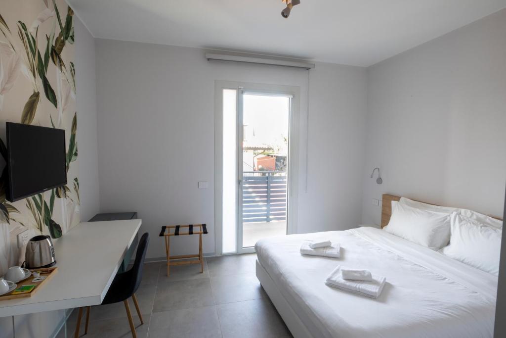 Postel nebo postele na pokoji v ubytování B&B Fior di Magnolia