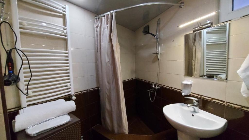 Koupelna v ubytování Hotel Visitor