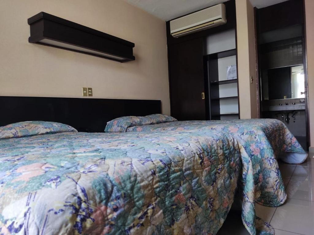 Postel nebo postele na pokoji v ubytování Hotel Mary Celaya