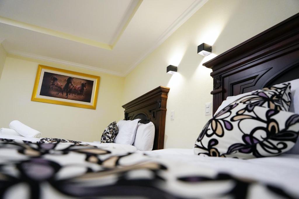 Postel nebo postele na pokoji v ubytování REAL DE LA PEÑA HOTEL 2