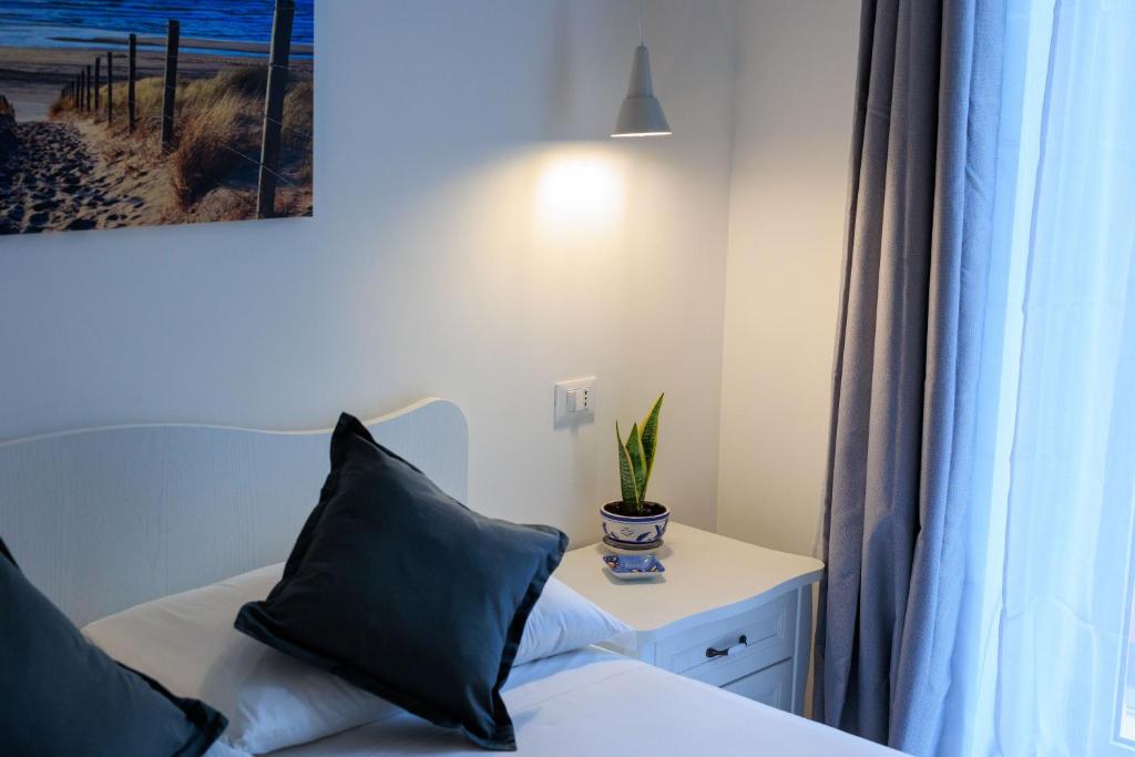 Postel nebo postele na pokoji v ubytování Miramare rooms b&b
