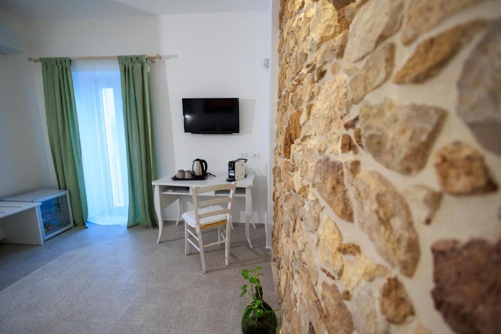 TV a/nebo společenská místnost v ubytování Miramare rooms b&b