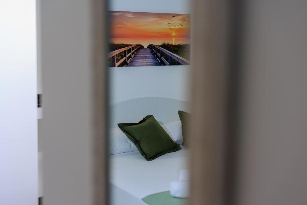 Postel nebo postele na pokoji v ubytování Miramare rooms b&b