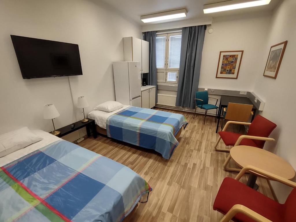 Postel nebo postele na pokoji v ubytování Hotel 24 - Karihaara - Kemi