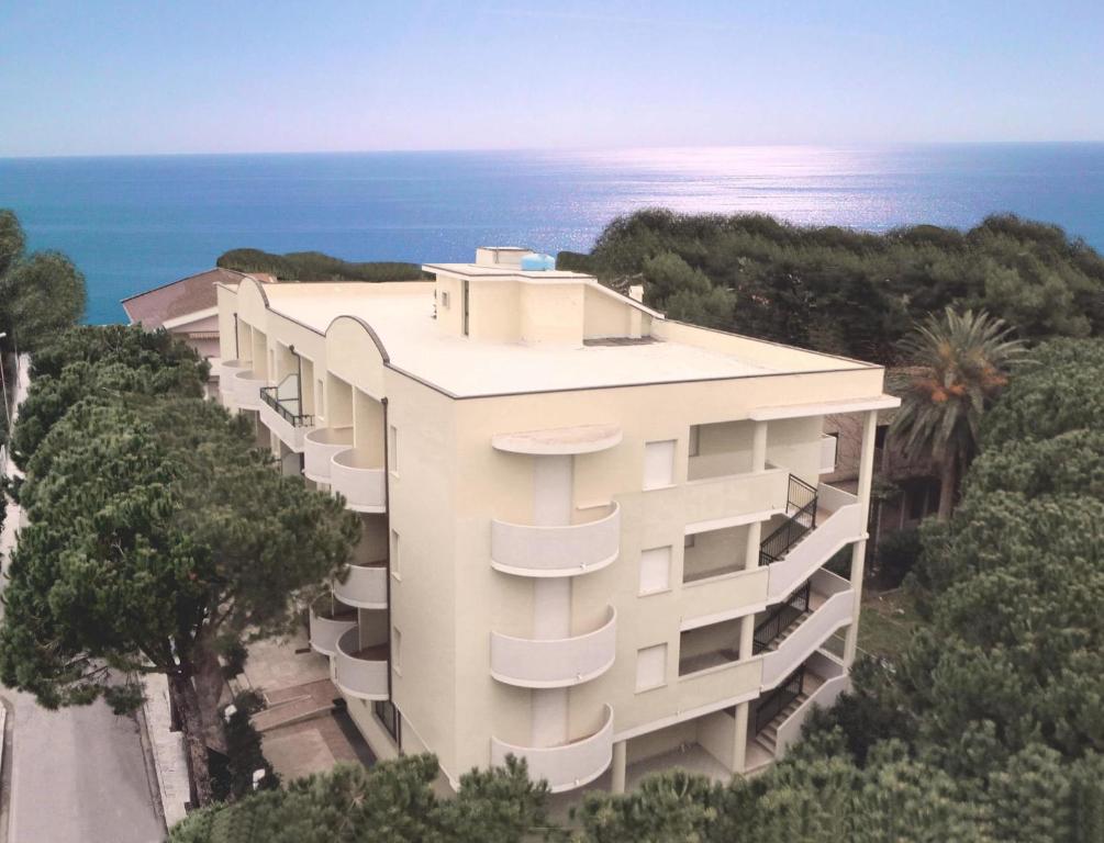 an aerial view of a building with the ocean in the background at Hotel Marebello in Tortoreto Lido