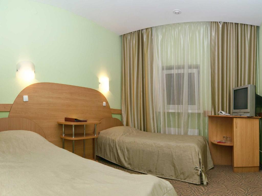 Кровать или кровати в номере Гостиница Луна