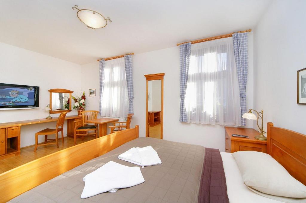 Postel nebo postele na pokoji v ubytování Hotel pizzeria Belmonte