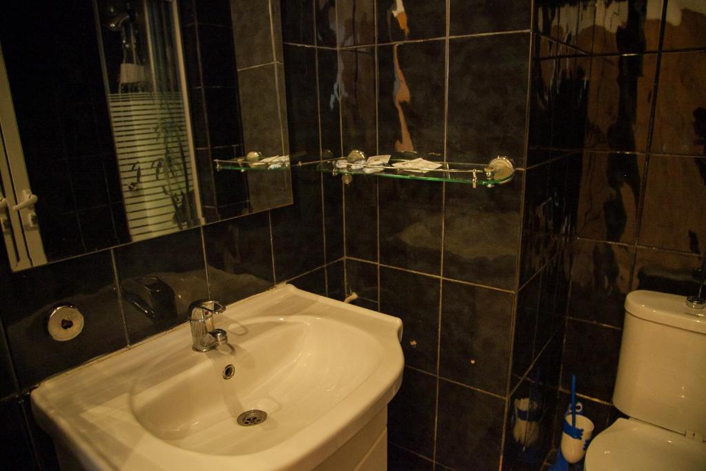 Koupelna v ubytování Hotel Vlasca