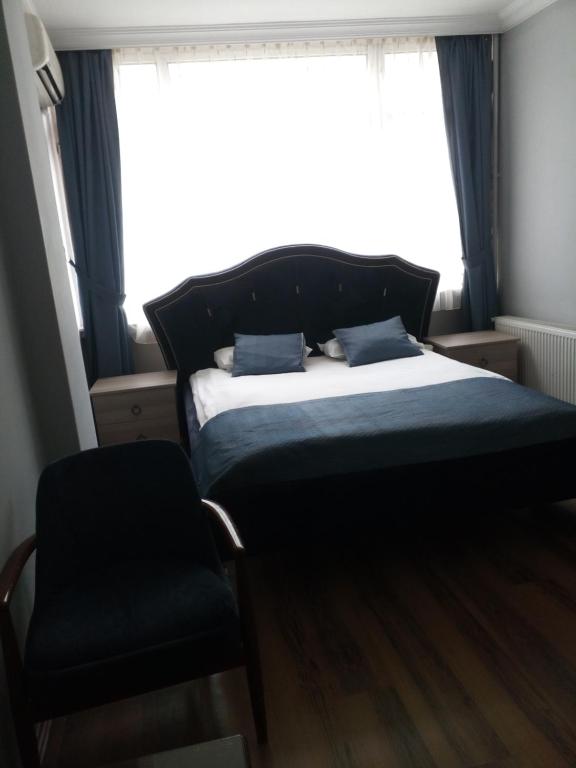 Postel nebo postele na pokoji v ubytování Tac Hotel