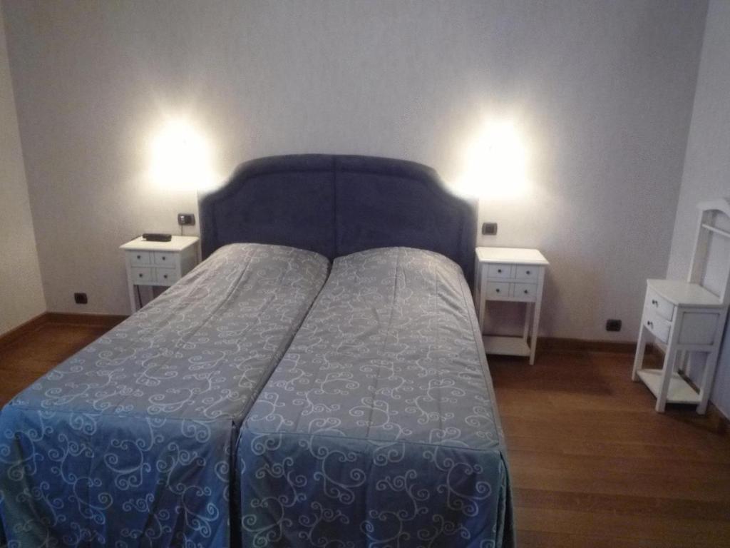 Postel nebo postele na pokoji v ubytování Le Château de Rendeux