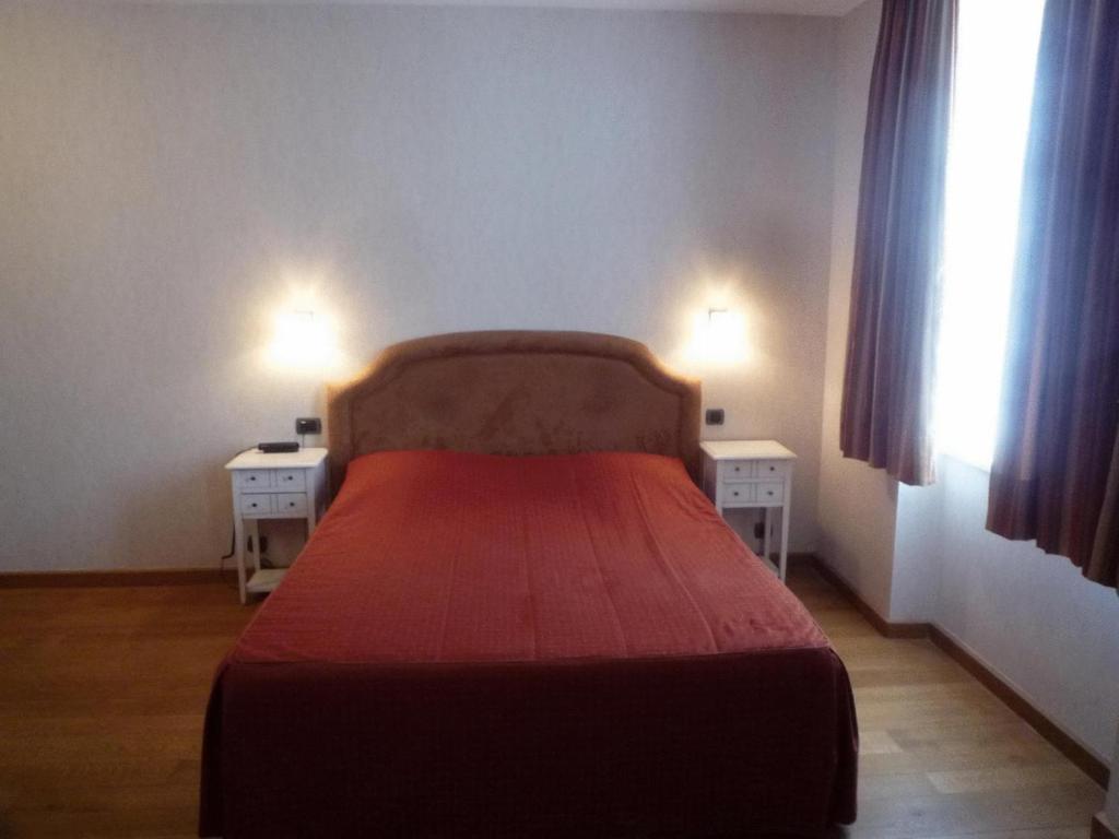 Postel nebo postele na pokoji v ubytování Le Château de Rendeux