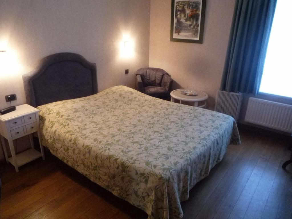 Postel nebo postele na pokoji v ubytování Le Château de Rendeux