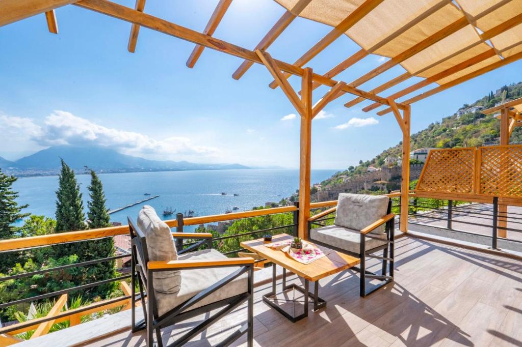 a house on the hill with a view of the ocean at Castle Boutique Hotel Alanya in Alanya