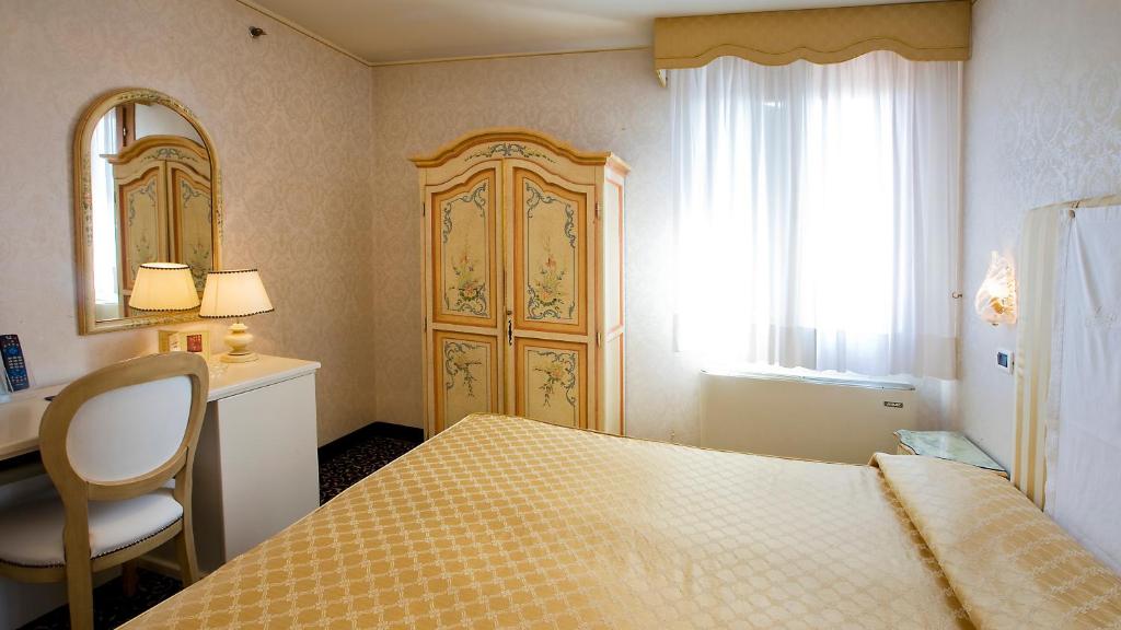 Postel nebo postele na pokoji v ubytování Hotel Principe