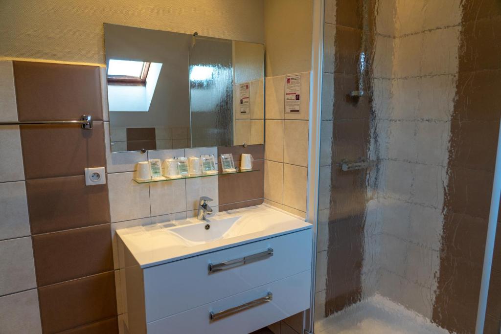 Koupelna v ubytování Au Primerose Hôtel