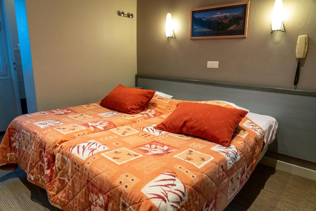 Postel nebo postele na pokoji v ubytování Au Primerose Hôtel