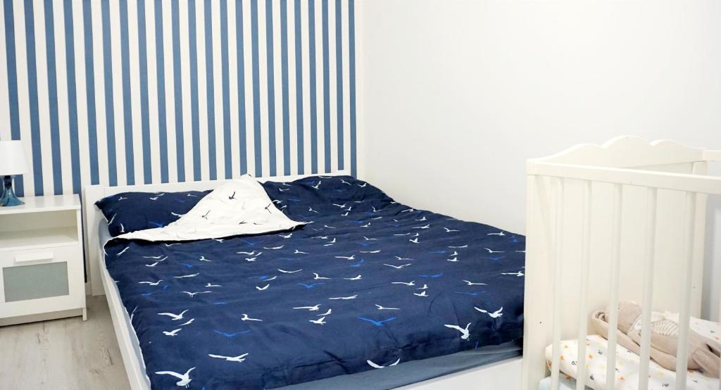 Posteľ alebo postele v izbe v ubytovaní Aura Apartament