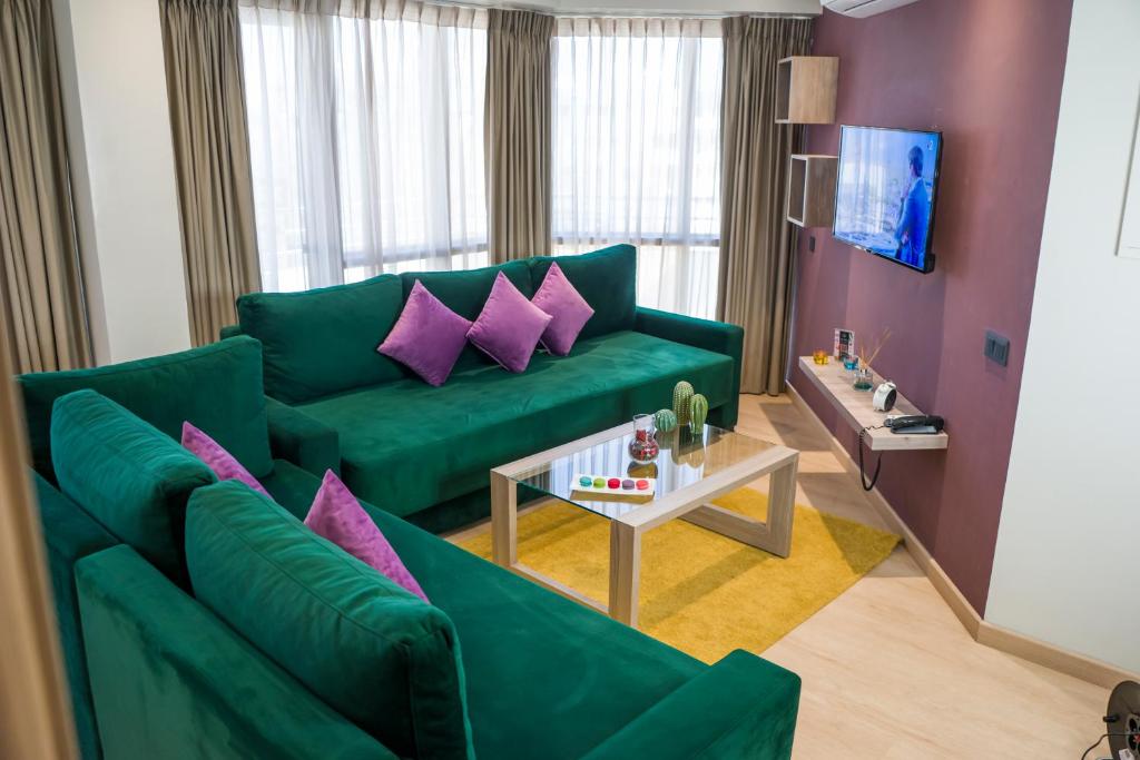 TV o dispositivi per l'intrattenimento presso Flamant Rose Appart Hotel