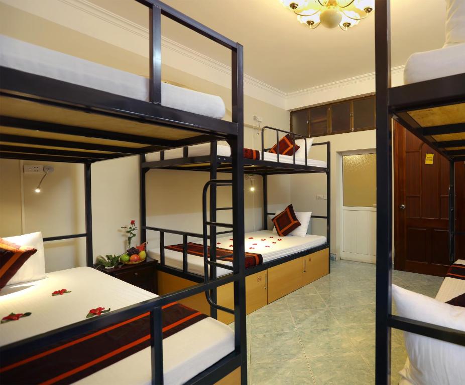 Postel nebo postele na pokoji v ubytování Hanoi City Backpackers Hostel