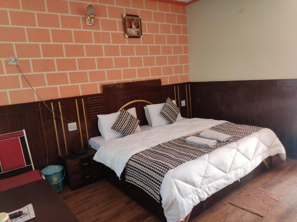 Lova arba lovos apgyvendinimo įstaigoje Hotel Deepraj, Kausani
