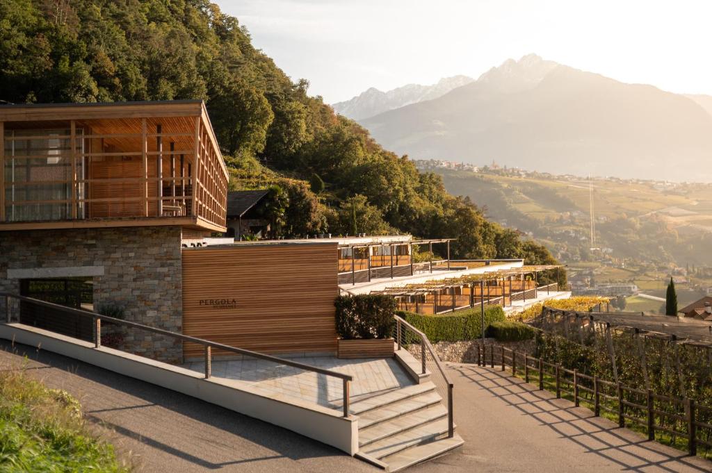 a house on the side of a mountain at Pergola Residence in Lagundo