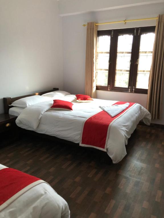 Llit o llits en una habitació de Hotel Bhagya