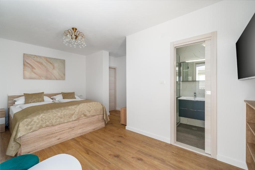 Postel nebo postele na pokoji v ubytování Rooms Vedrana