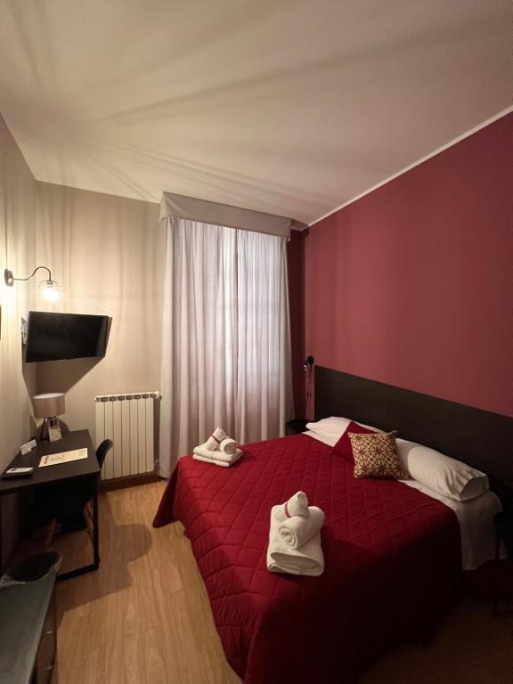 Posteľ alebo postele v izbe v ubytovaní Hotel Marconi