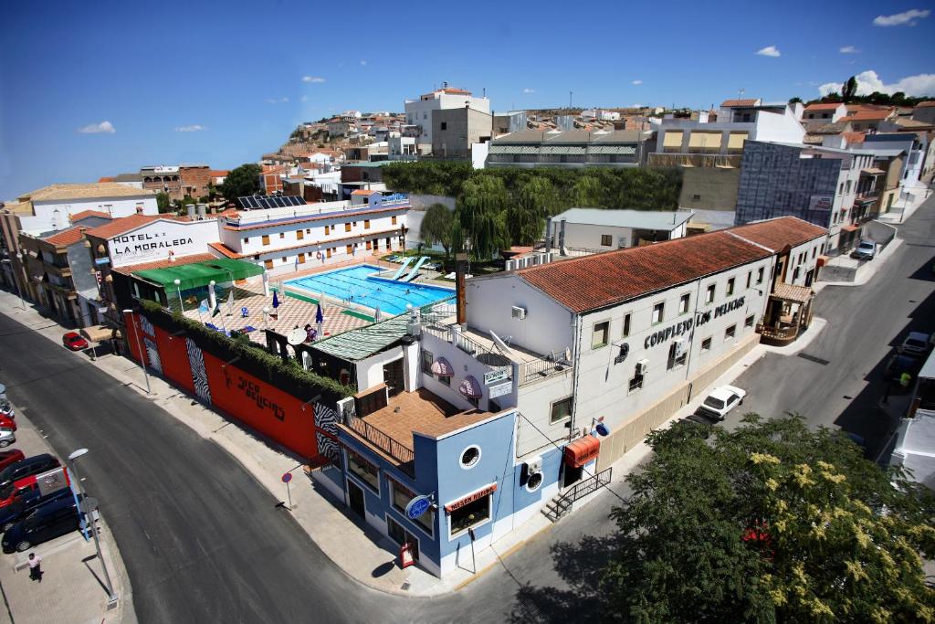 an overhead view of a city with a swimming pool at Hotel La Moraleda - Complejo Las Delicias in Villanueva del Arzobispo