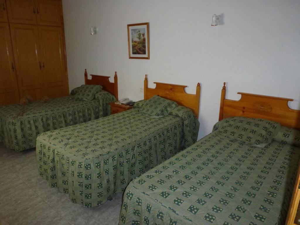 Postel nebo postele na pokoji v ubytování Hotel La Moraleda - Complejo Las Delicias