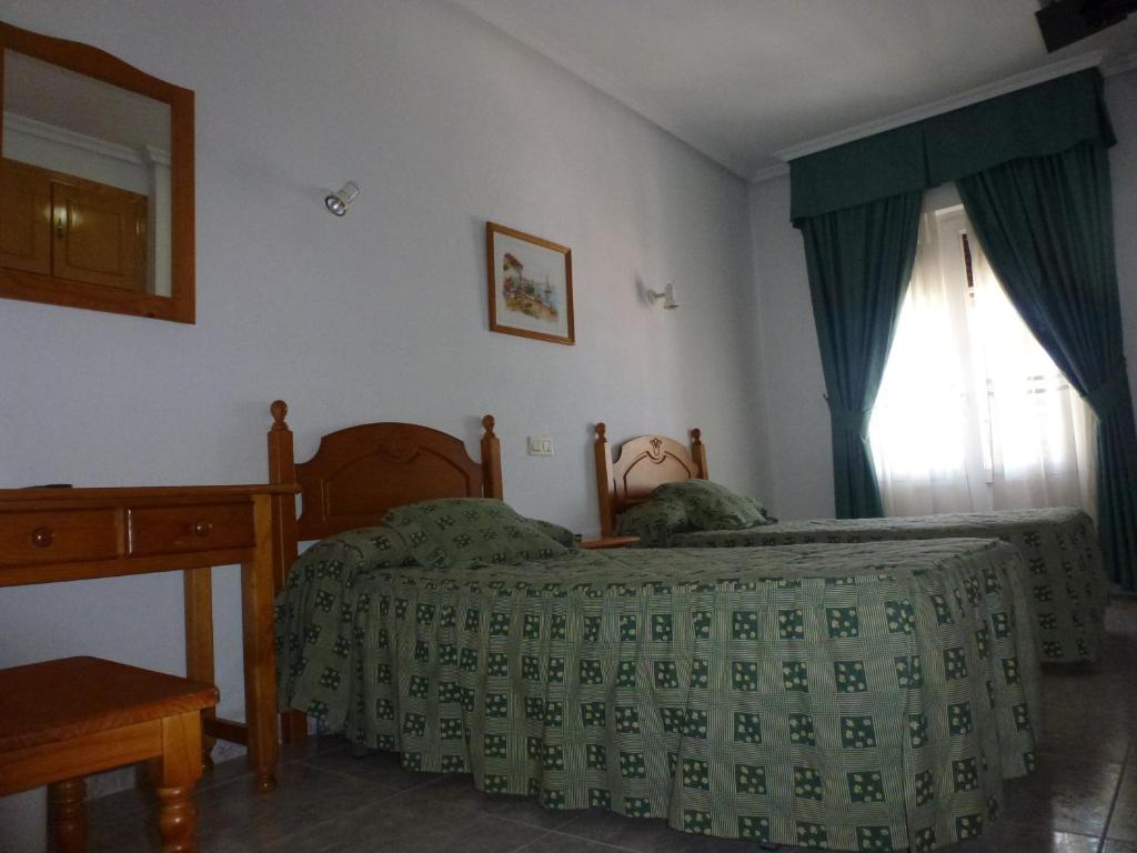 Postel nebo postele na pokoji v ubytování Hotel La Moraleda - Complejo Las Delicias