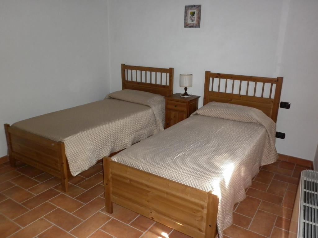 Postel nebo postele na pokoji v ubytování Podere Le Grotte