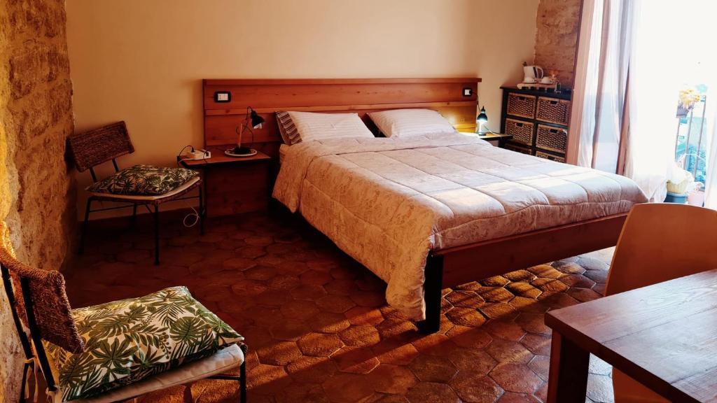 Postel nebo postele na pokoji v ubytování Aljama - Downtown B&B