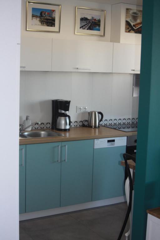 Kuchyňa alebo kuchynka v ubytovaní Apartament zielony