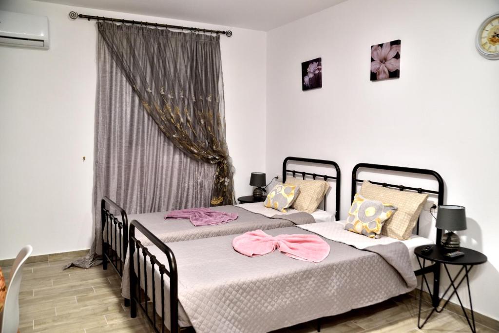 Postel nebo postele na pokoji v ubytování PLUMERIA HOUSE