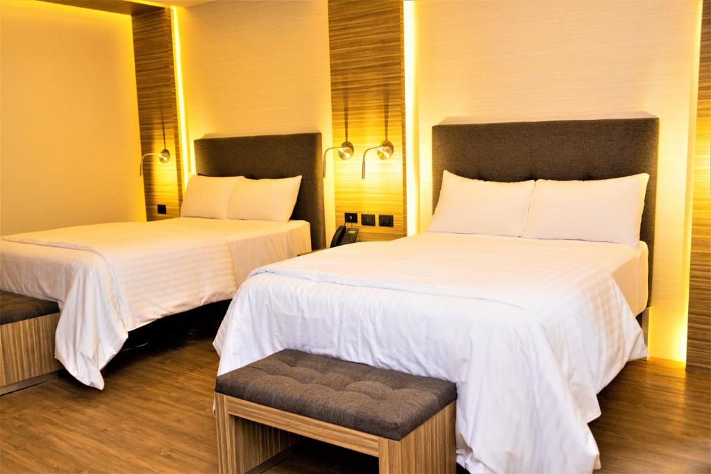 Postel nebo postele na pokoji v ubytování Hotel Plaza by Kavia